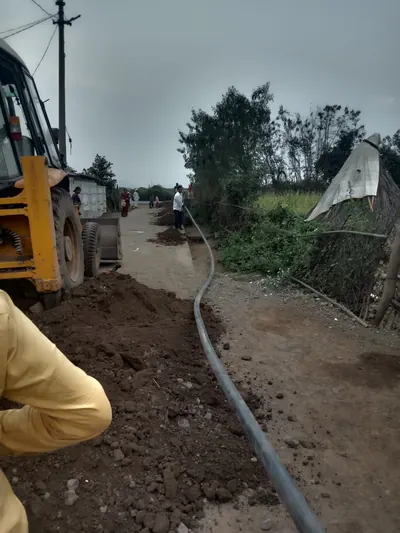 HDPE water line laid along a village road