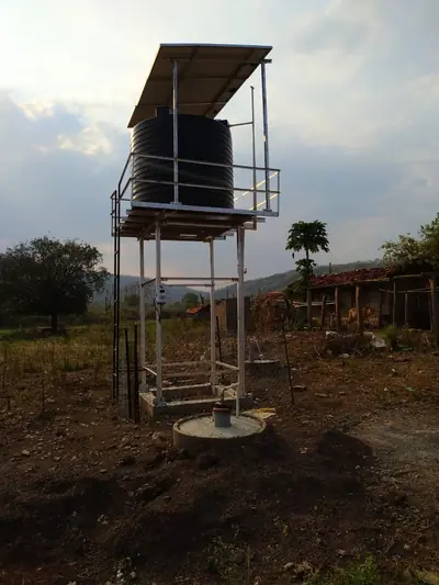 Finished solar-pump water system at dusk
