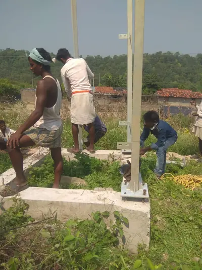Team fixing a steel column to its concrete base